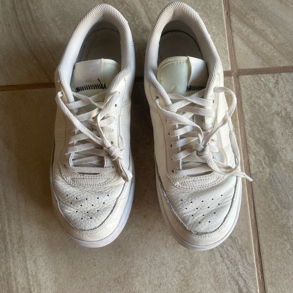Cream Nike sneakers
